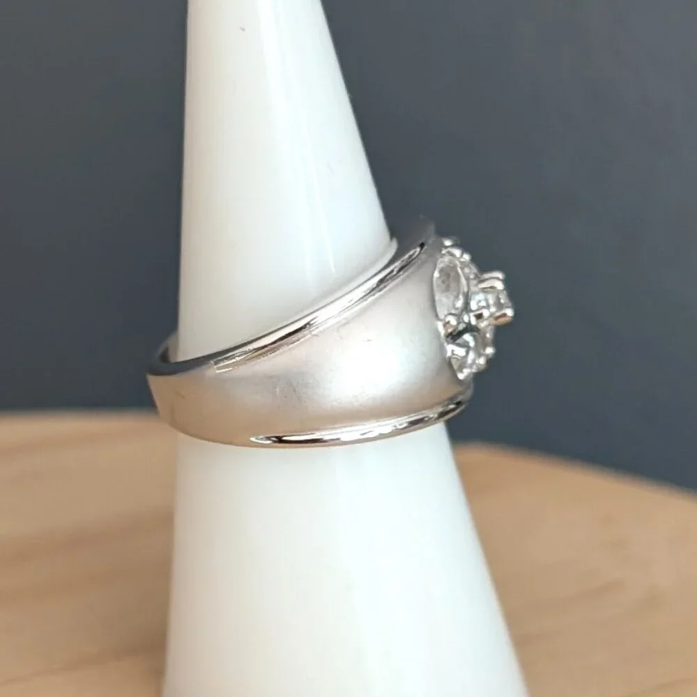 Matte brushed silver tone and faux diamond wide band ring